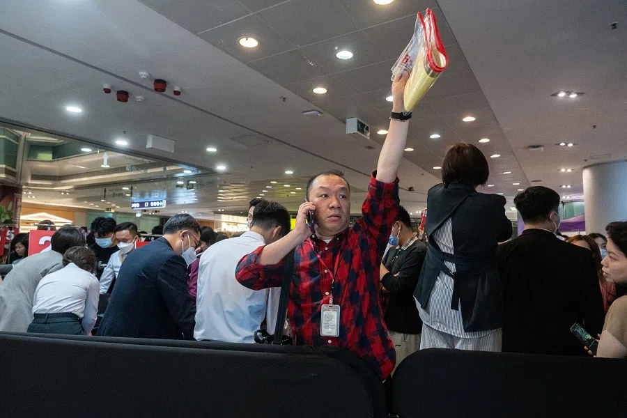  An agent at the sales office of the Blue Coast housing project, developed by CK Asset Holdings Ltd., in Hong Kong, China, on 6 April 2024. (Chan Long Hei/Bloomberg)