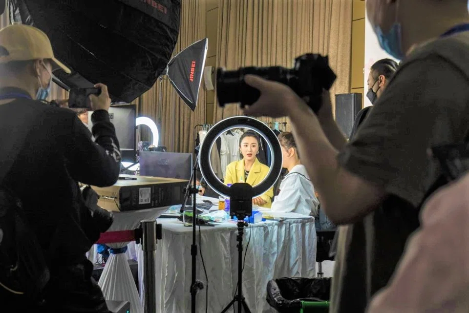 Livestreamer Huang Wei, known professionally as Viya, sits behind a ring light during a special livestreaming event arranged by Qianxun Group in Wuhan, Hubei Province, China, on 30 April 2020. (Qilai Shen/Bloomberg)