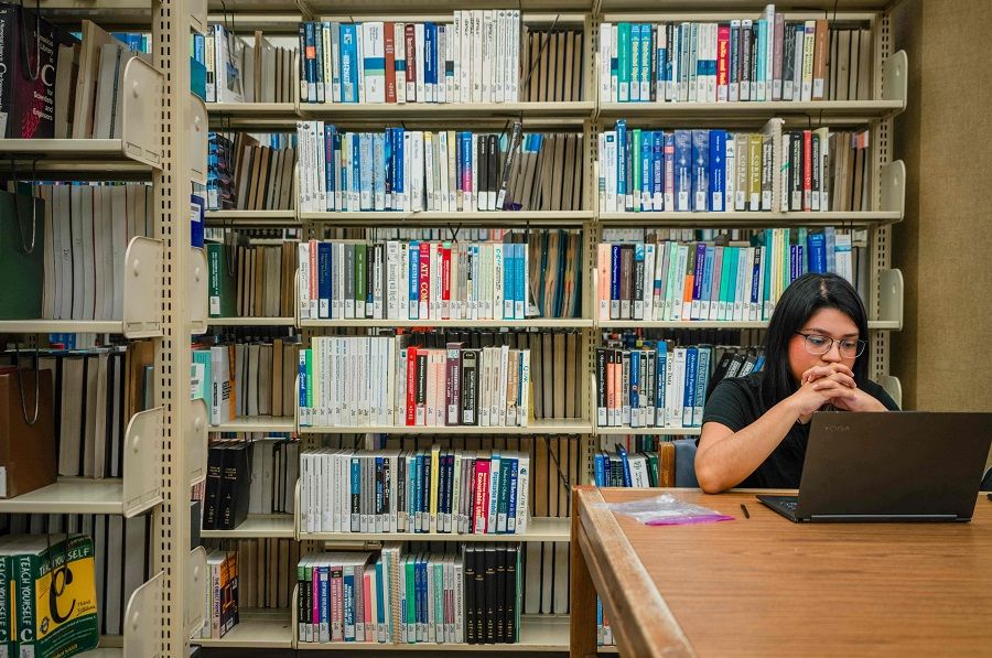 A student studies in a library at the University of Texas on 22 February 2024 in Austin, Texas. (Brandon Bell/Getty Images/AFP)
