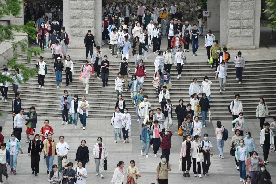Students leave after their first exam during the first day of the National College Entrance Examination (NCEE), known as "gaokao", in Nanjing, in China's eastern Jiangsu province on 7 June 2023. (AFP)