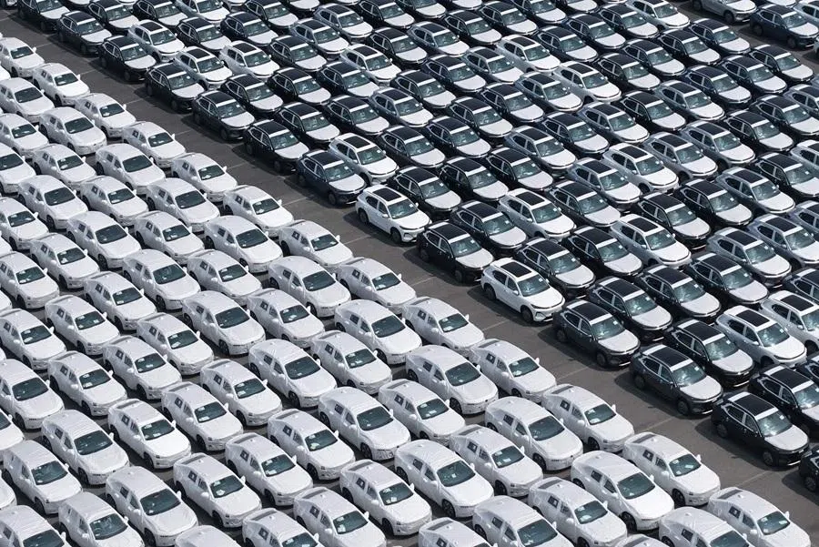 Chinese-made cars are seen before being loading for export at the vehicle export terminal in the port of Shanghai on 14 July 2026.