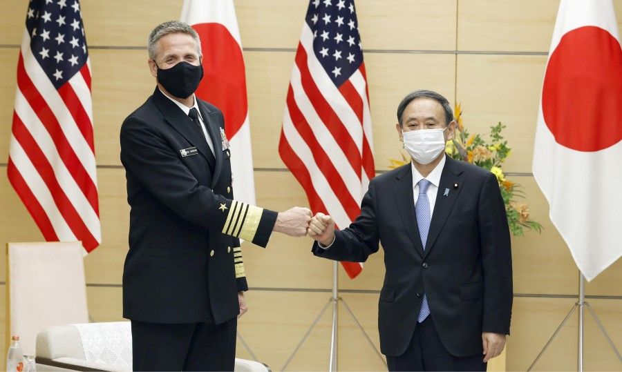 Admiral Philip S. Davidson, commander of the U.S. Indo-Pacific Command meets with Japan's Prime Minister Yoshihide Suga during his courtesy call at the prime minister's office in Tokyo, 22 October 2020. (Kyodo via REUTERS)