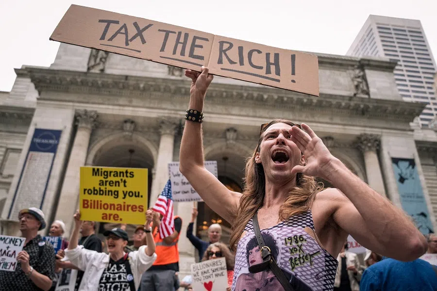 Protestors shout during a demonstration against the Trump administration and billionaire class outside the New York Public Library in Midtown in New York City, US, on 7 May 2025. (Angelina Katsanis/Reuters)