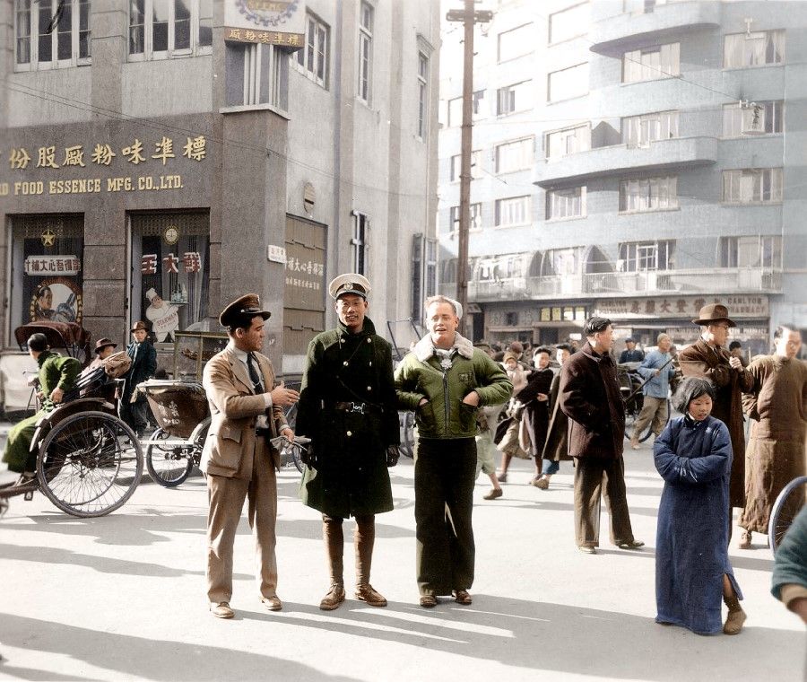After winning the war, US military vessels started to dock at Shanghai. The photo shows US officers going on shore in Shanghai, with the city and its people. After WWII, China went through a period of comparing the Chinese lifestyle with that of people from other countries.