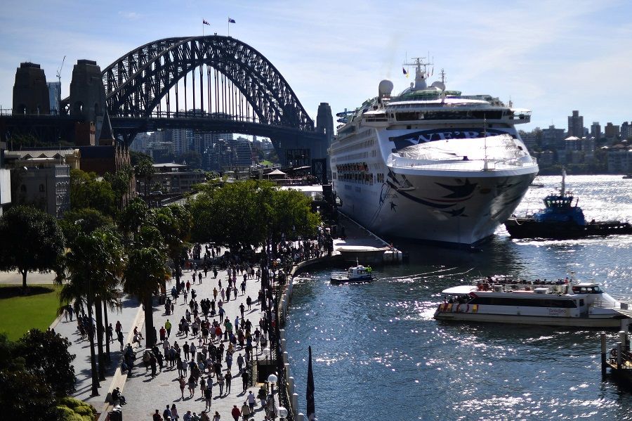 The Pacific Explorer makes its way to dock at the overseas passenger terminal on Sydney Harbour on 18 April 2022, as Australian authorities lifted a ban on cruise ships after relaxation in Covid-19 restrictions. (Saeed Khan/AFP)