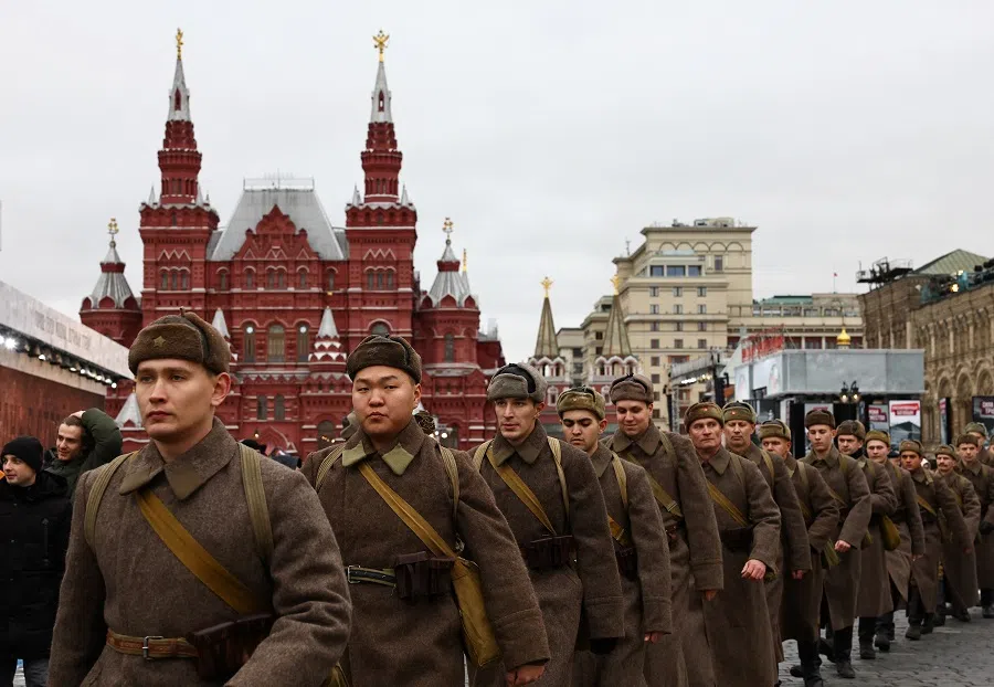 Participants walk during an exhibition marking the anniversary of a historical military parade in 1941, when Soviet soldiers marched from Red Square towards the front lines in the course of World War Two, in central Moscow, Russia, on 8 November 2024. (Evgenia Novozhenina/Reuters)
