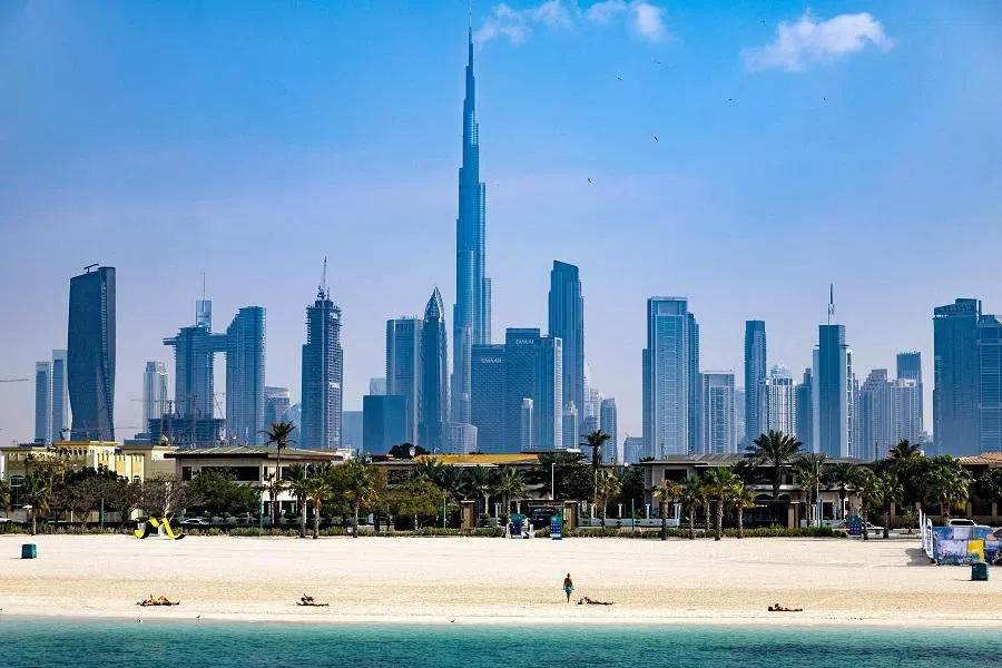 Burj Khalifa, the world’s tallest building, adorns the Dubai skyline as people sunbathe on Jumeirah Beach, Dubai, United Arab Emirates,
on 30 January 2025. (Fadel Senna/AFP)