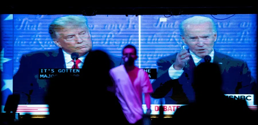 People watch the second 2020 presidential campaign debate between Joe Biden and Donald Trump at The Abbey Bar in West Hollywood, California, US, on 22 October 2020. (Mario Anzuoni/Reuters)