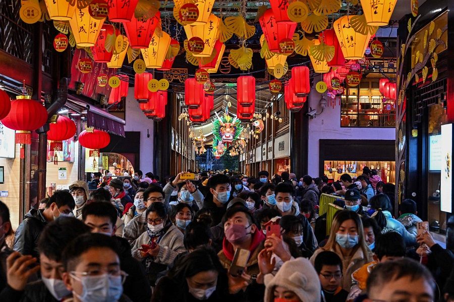 People visit the Yu Garden in Shanghai, China, on 15 February 2022. (Hector Retamal/AFP)