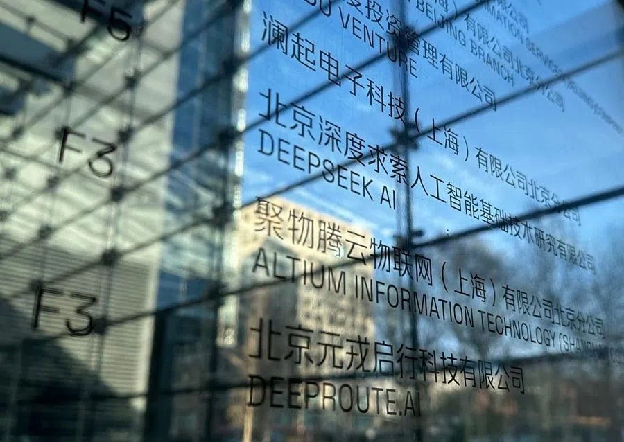 Floor signage for the offices of DeepSeek (centre) is seen in Beijing on 28 January 2025.