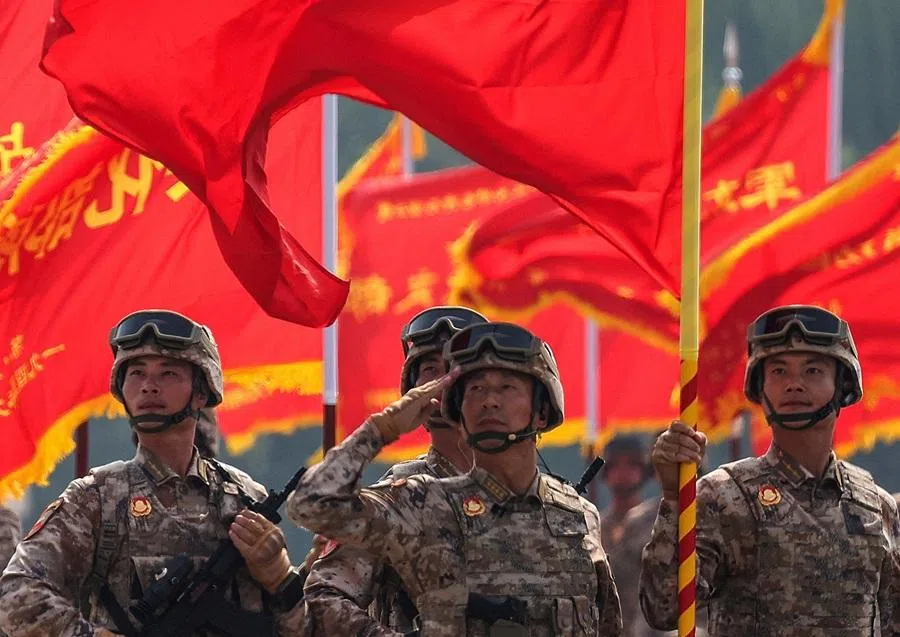 Flags flutter as soldiers participate in a military parade to mark the 80th anniversary of the end of World War Two, in Beijing, China, on 3 September 2025. (Maxim Shemetov/Reuters)