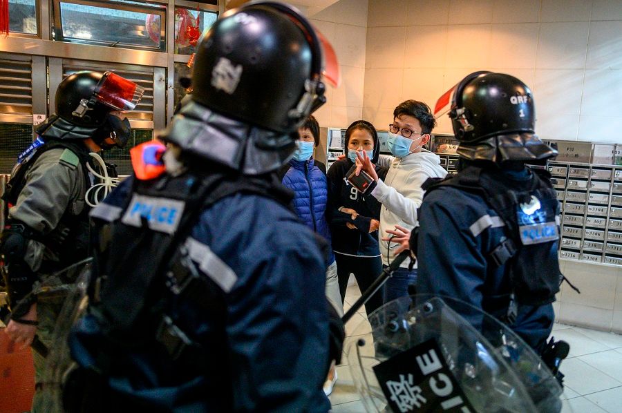 Protesters threw petrol bombs on the night of 26 January 2020 at an empty public housing complex in Hong Kong that had been earmarked to become a temporary quarantine zone as the city battles the Covid-19 outbreak. (Philip Fong/AFP)