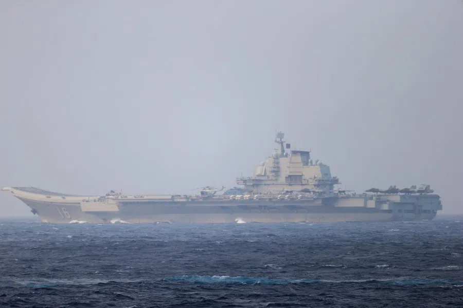 Chinese aircraft carrier Liaoning sails through the Miyako Strait near Okinawa on its way to the Pacific in this handout photo taken by Japan Self-Defense Forces and released by the Joint Staff Office of the Defense Ministry of Japan on 4 April 2021. (Joint Staff Office of the Defense Ministry of Japan/Handout via Reuters)