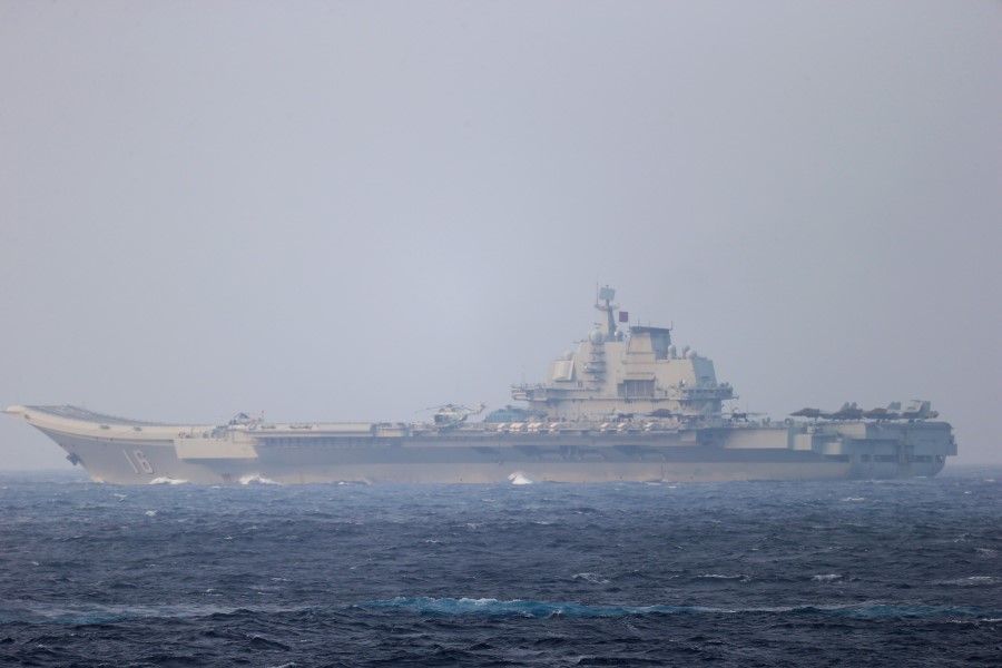 Chinese aircraft carrier Liaoning sails through the Miyako Strait near Okinawa on its way to the Pacific in this handout photo taken by Japan Self-Defense Forces and released by the Joint Staff Office of Japan's defence ministry on 4 April 2021. (Joint Staff Office of the Ministry of Defense, Japan/Handout via Reuters)