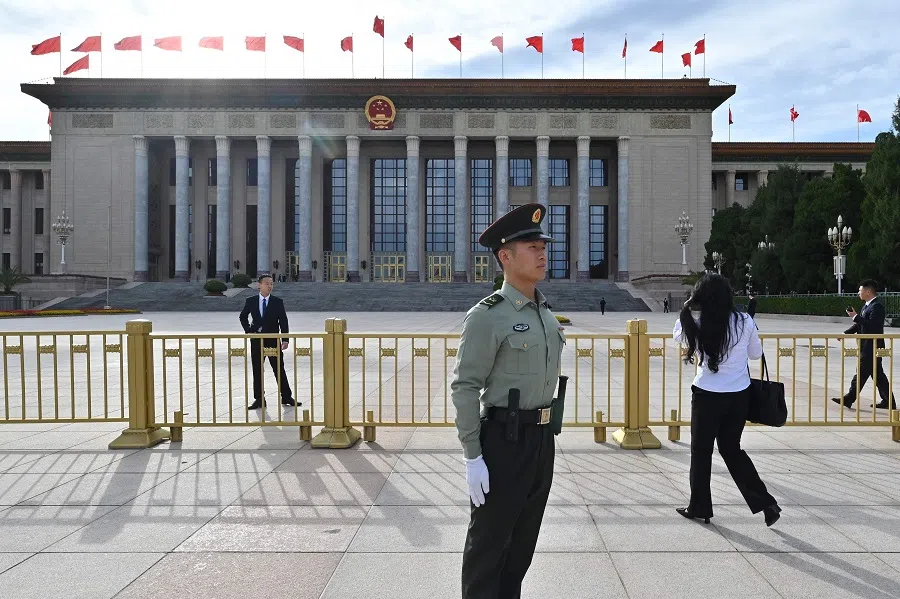 Security officials stand guard outside the Great Hall of the People, in Beijing, China, on 30 September 2024. (Adek Berry/AFP)