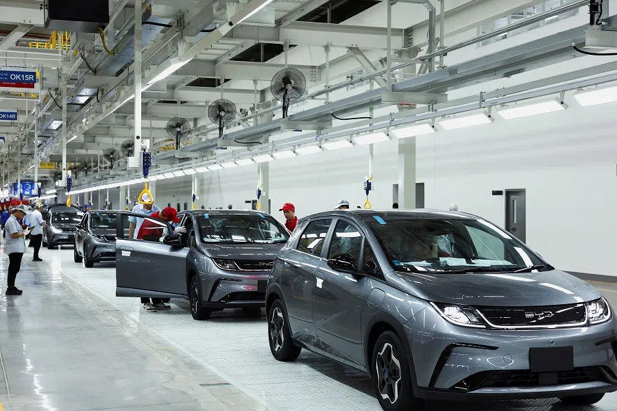Workers check EV cars inside BYD’s first electric vehicle (EV) factory in Southeast Asia, in Rayong, Thailand, on 4 July 2024. (Chalinee Thirasupa/Reuters)