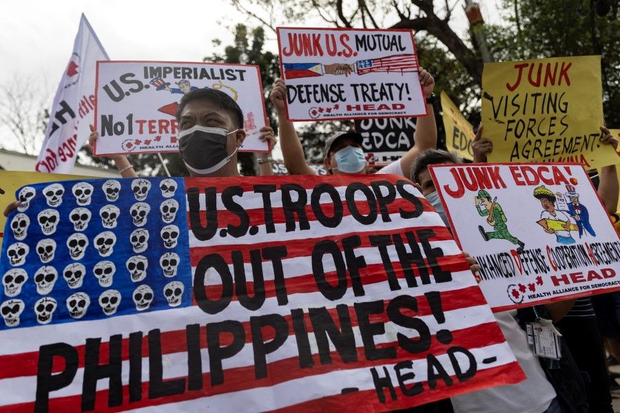 Filipino activists protest against the visit of US Defence Secretary Lloyd Austin, outside the military headquarters, Camp Aguinaldo, in Quezon City, Philippines, 2 February 2023. (Eloisa Lopez/Reuters)