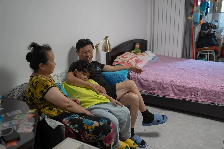 Zhuangzhuang hangs out with his grandparents after finishing his homework. Zhuangzhuang’s mom and dad both have full-time jobs, and his grandparents take turns with his mom to shuttle Zhuangzhuang between his classes and dance practice.