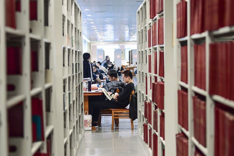 Examinations play a huge role in China society. This photo taken on November 26, 2019 shows university students preparing for the upcoming National Postgraduate Entrance Exam (NPEE) at a library in Shenyang in China's northeastern Liaoning province. (STR/AFP)