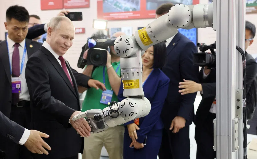Russian President Vladimir Putin tours an exhibition at the 8th China-Russia Expo in Harbin, China, on 17 May 2024. (Sputnik/Mikhail Metzel/Pool via Reuters)