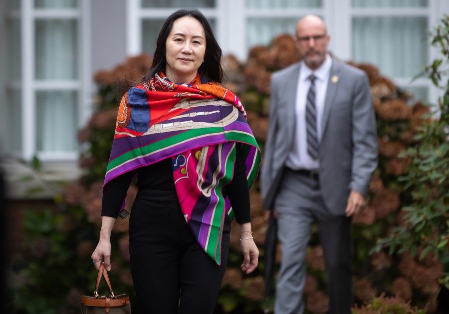 Meng Wanzhou, chief financial officer of Huawei Technologies Co., leaves her home to attend Supreme Court for a hearing in Vancouver, British Columbia, Canada, on 30 October 2020. (Darryl Dyck/Bloomberg)