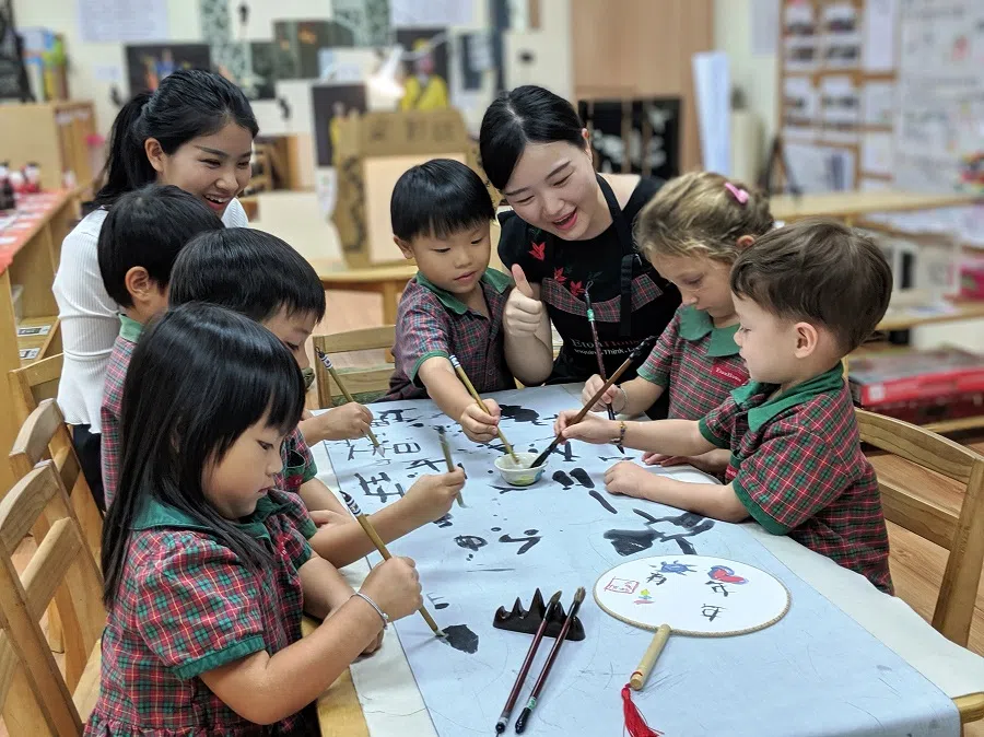Children, aged four to five, from EtonHouse Zhong Hua Pre-school in Singapore being introduced to calligraphy as part of Chinese immersion, in 2019. (Eton House)