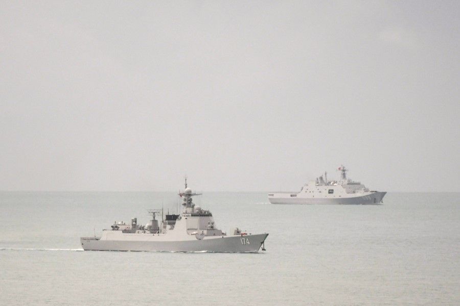 A PLA-N Luyang-class guided missile destroyer and a PLA-N Yuzhao-class amphibious transport dock vessel leave the Torres Strait and enter the Coral Sea, 18 February 2022. (Australian Defence Department/Handout via Reuters)