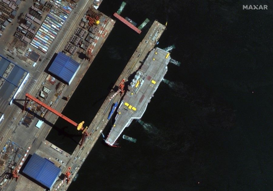 The Shandong, China's second operationally ready aircraft carrier, is seen docked in Dalian. (Maxar Technologies/Handout via REUTERS)