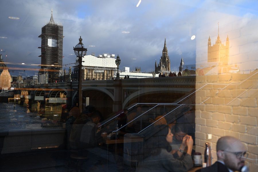 Big Ben and the Houses of Parliament are seen reflected in a cafe window during ongoing renovations to the Tower and the Houses of Parliament, in central London on 17 January 2020. (Daniel Leal-Olivas/AFP)