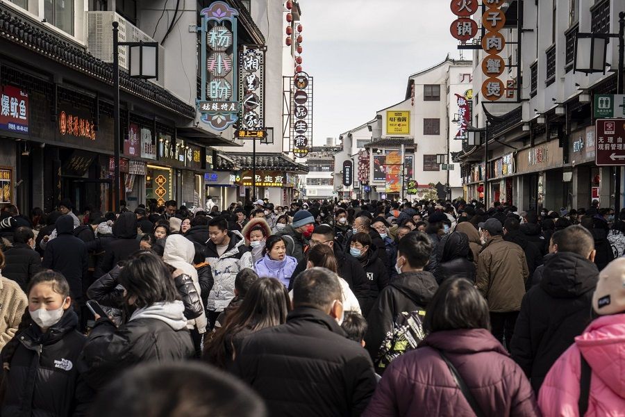 Shoppers in the Guanqian Street shopping area in Suzhou, Jiangsu province, China, on 25 January 2023. (Qilai Shen/Bloomberg)