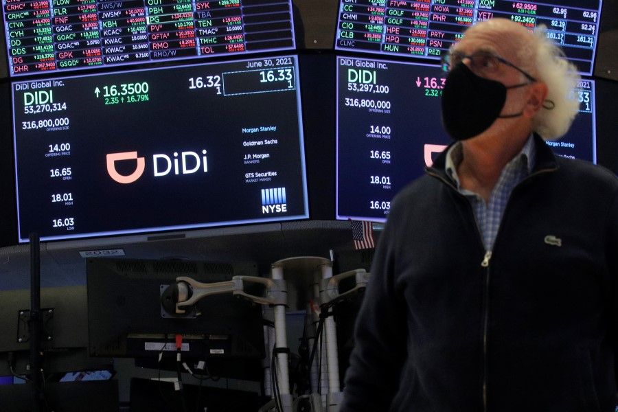 Traders work during the IPO for Chinese ride-hailing company Didi Global Inc on the New York Stock Exchange (NYSE) floor in New York City, US, 30 June 2021. (Brendan McDermid/Reuters)