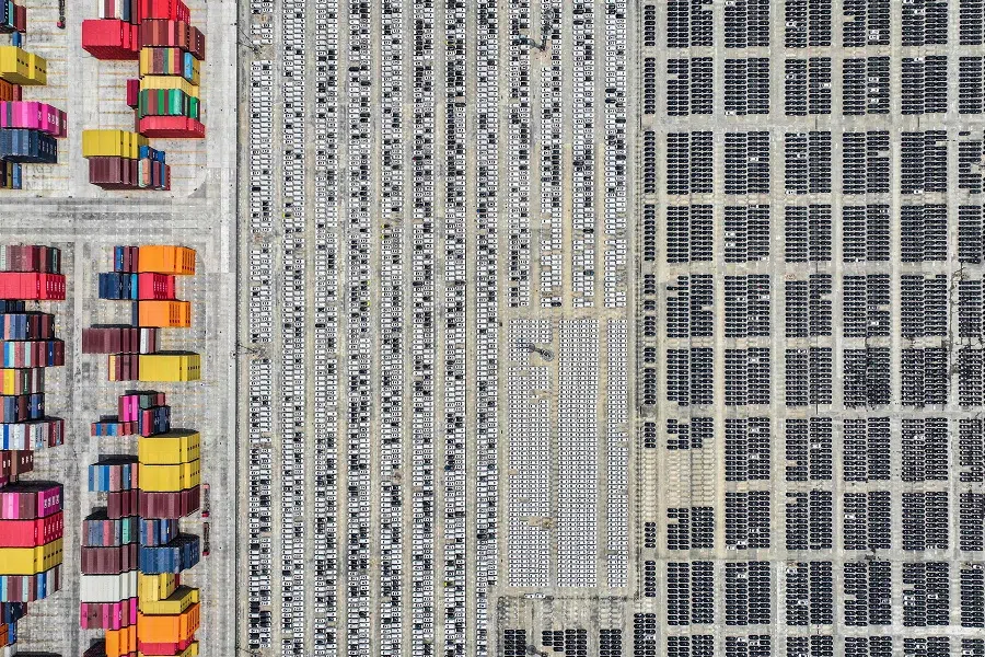 An aerial view shows cars for export at a port in Nanjing, in eastern China’s Jiangsu province, on 29 April 2025. (AFP)
