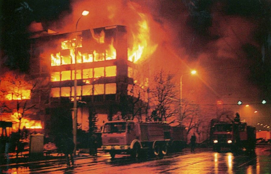 Flames soar into the sky following the NATO bombing of the Chinese embassy in Yugoslavia, May 1999.