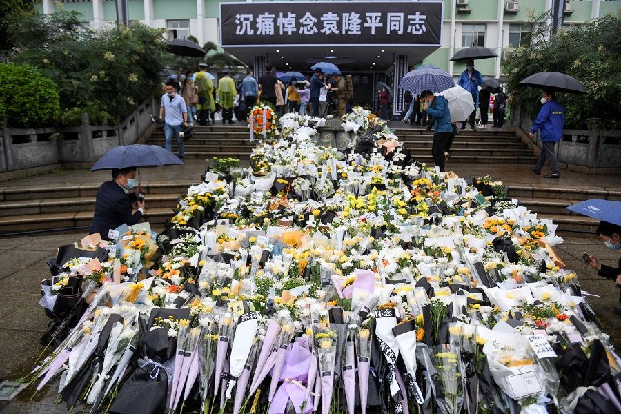 Flowers are laid in memory of Yuan Longping outside the Hunan Hybrid Rice Research Center in Changsha, Hunan province, China on 23 May 2021. (CNS photo via Reuters)