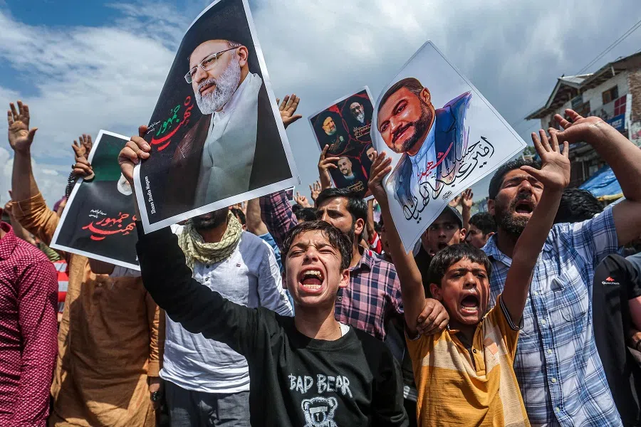 Shiite Muslims shout slogans as they express their grief for Iran’s late president Ebrahim Raisi who died in a helicopter crash, during a solidarity march on the outskirts of Srinagar on 24 May 2024.