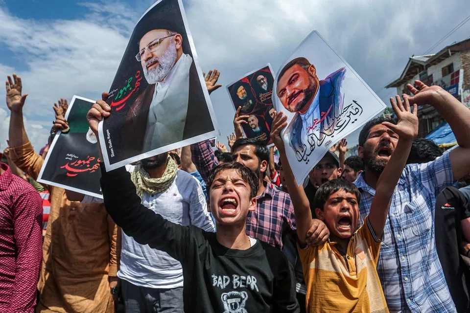 Shiite Muslims shout slogans as they express their grief for Iran’s late president Ebrahim Raisi who died in a helicopter crash, during a solidarity march on the outskirts of Srinagar on 24 May 2024. (Abid Bhat/AFP)