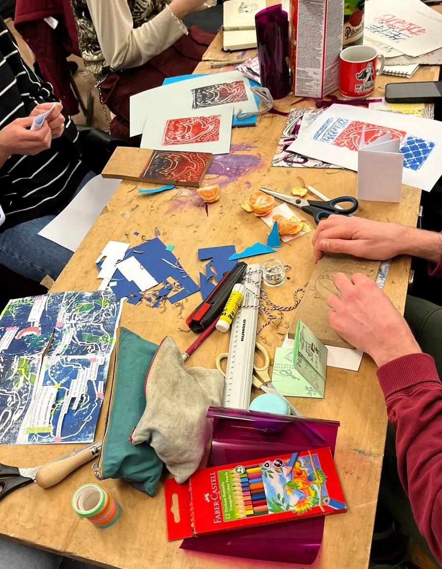 Ye Fei making a zine out of easily available materials.