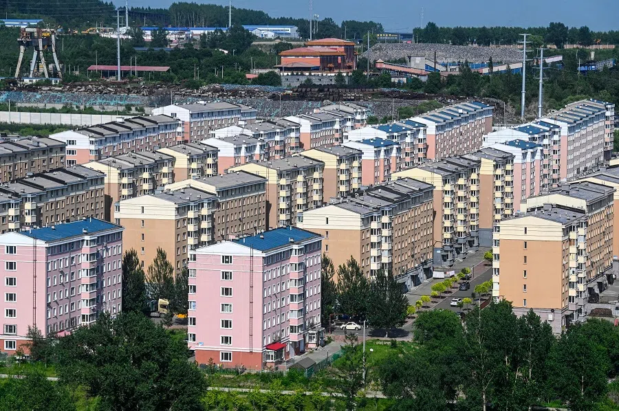 This photo taken on 4 July 2023 shows a general view of residential buildings in Hegang city in northeastern China's Heilongjiang province. (Jade Gao/AFP)