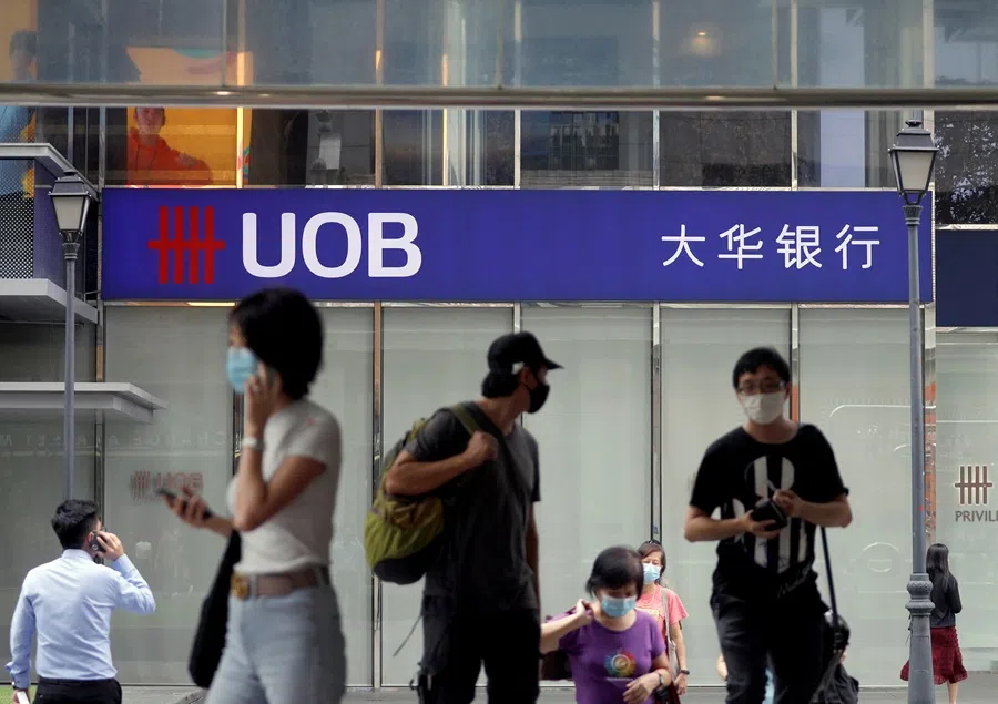 People pass by a UOB bank branch in Singapore on 4 November 2020. (Edgar Su/Reuters)