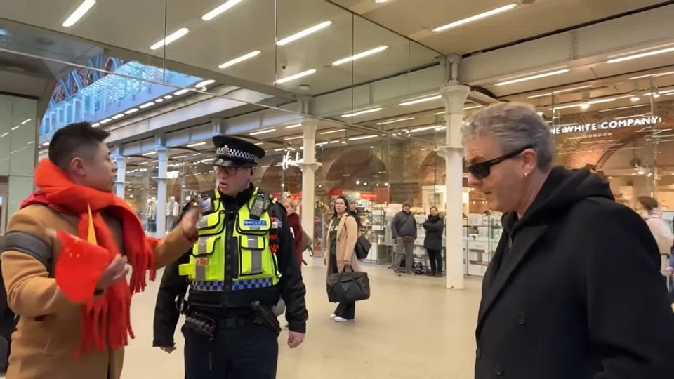 Screenshot of a video showing the argument between British pianist Brendan Kavanagh and a Chinese TV group, with the police entering the scene. (YouTube)