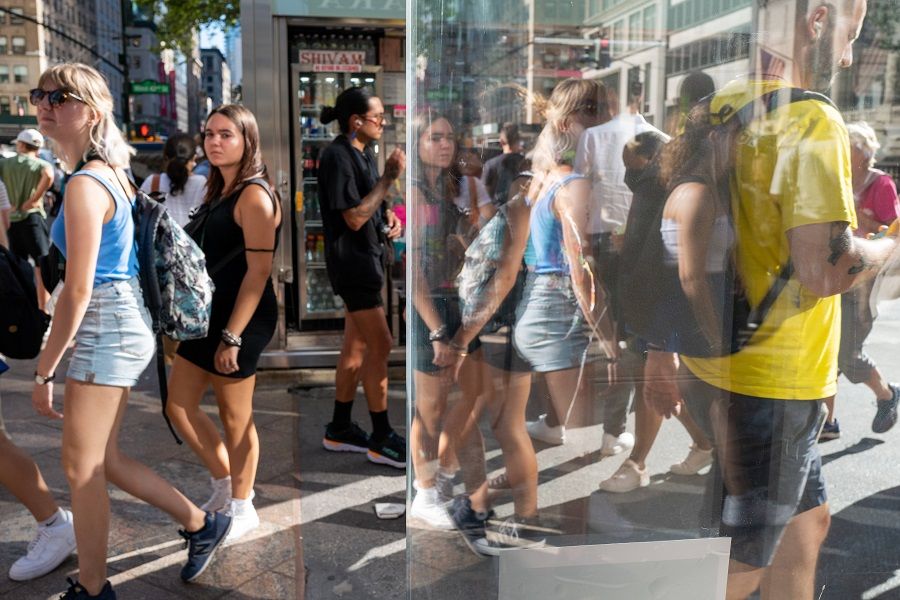 People walk through Midtown Manhattan on 3 August 2022 in New York City, US. (Spencer Platt/Getty Images)