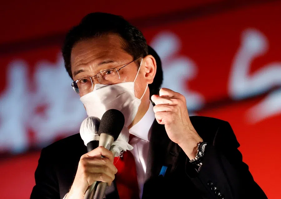 Japanese Prime Minister Fumio Kishida, who is also the President of the ruling Liberal Democratic Party, delivers a speech to voters from atop the campaigning bus on the last day of campaigning for the 31 October lower house election, in Tokyo, Japan, 30 October 2021. (Issei Kato/File Photo/Reuters)