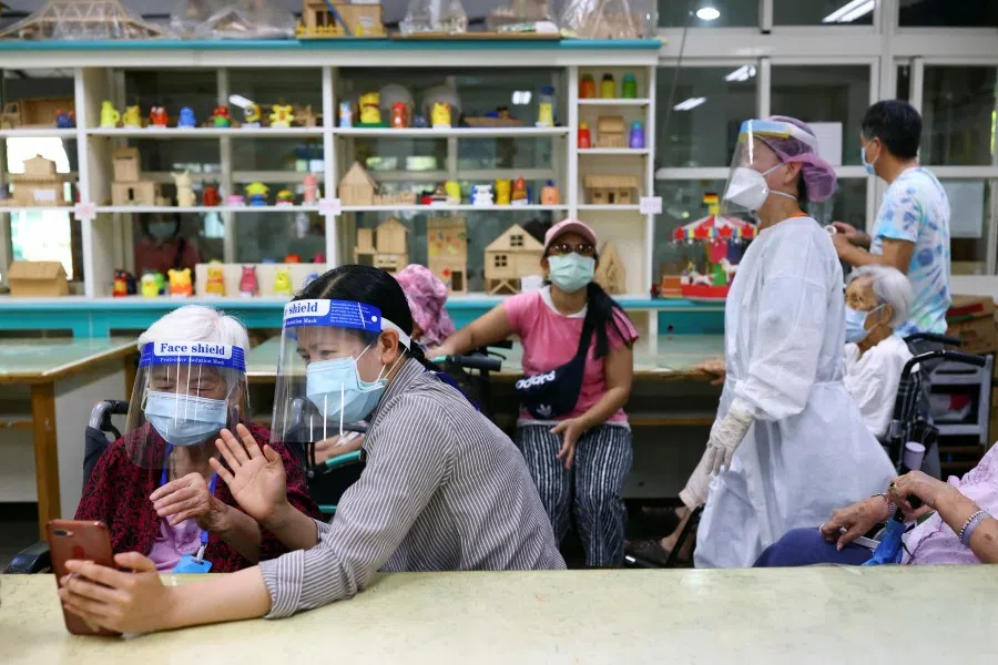 People wait during a vaccination session for elderly people over 85 years old at a school following the coronavirus disease (COVID-19) outbreak in Taipei, Taiwan, 15 June 2021. (Ann Wang/Reuters)
