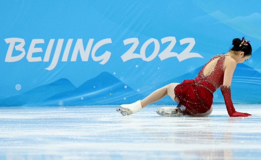 Zhu Yi of China falls during a routine at the figure skating event at the 2022 Beijing Olympics in the Capital Indoor Stadium, Beijing, China 7 February 2022. (Aleksandra Szmigiel/Reuters)