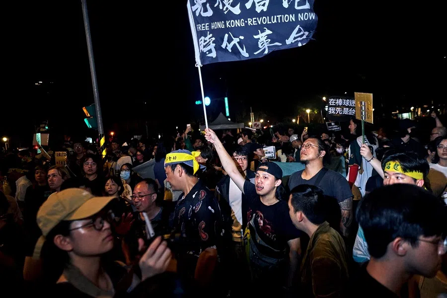 A shot of demonstrators during a protest outside the Legislative Yuan in Taipei, Taiwan, on 24 May 2024.  (An Rong Xu/Bloomberg)