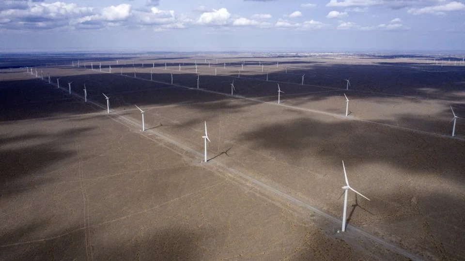 Wind turbines on the outskirts of the new city area of Yumen, Gansu province, China on 31 March 2021. (Qilai Shen/Bloomberg)