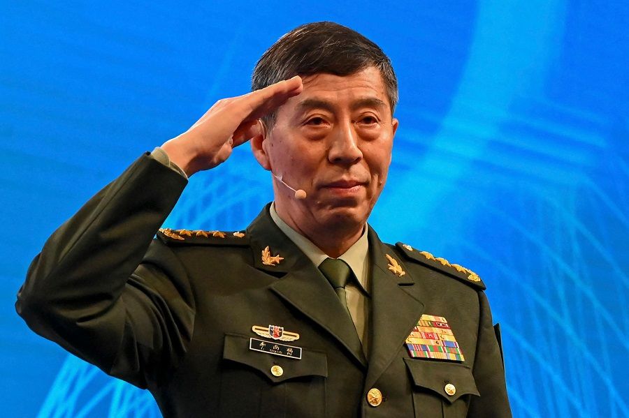 China's Defence Minister Li Shangfu salutes before delivering a speech during the 20th Shangri-La Dialogue summit in Singapore on 4 June 2023. (Roslan Rahman/AFP)