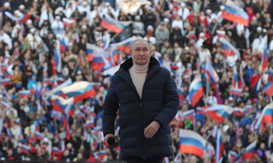 Russian President Vladimir Putin attends a concert marking the eighth anniversary of Russia's annexation of Crimea at the Luzhniki stadium in Moscow on 18 March 2022. (Mikhail Klimentyev/SPUTNIK/AFP)