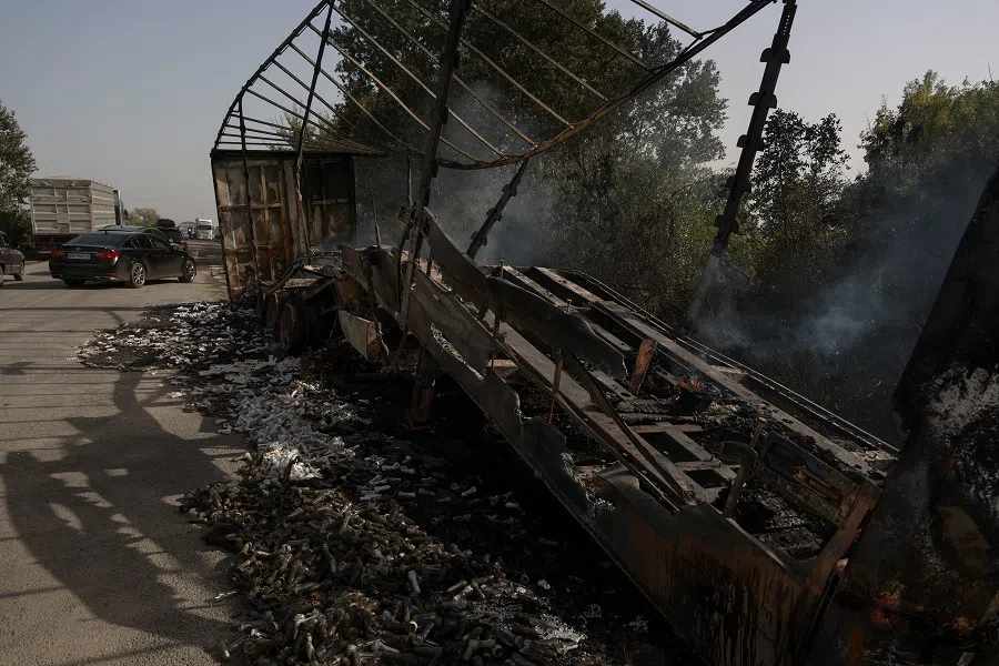 A view shows a semi-truck destroyed during a Russian drone strike near Ukraine-Romania border, amid Russia’s attack on Ukraine, in Odesa region, Ukraine, 2 October 2024. (Nina Liashonok/Reuters)