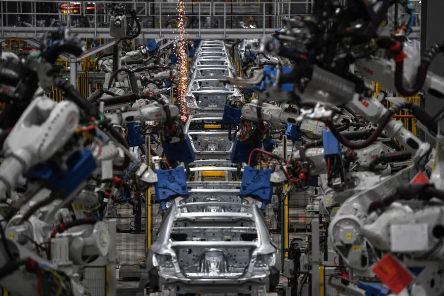 This file photo taken on 26 August 2022 shows vehicles being made on an automated production line at the VinFast electric automobile plant in Haiphong. (Nhac Nguyen/AFP)